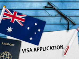 189 visa nomination - Visa Application with Passport, Australian flag, pen and glasses on blue background - contact HCM Legal today