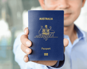 Man holding Australian Passport -Australian Visa for Canadians Entry Requirements - contact HCM Legal today.