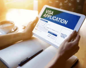 Girl using ipad for online Visa Application -Online Australian Visa for Canadians - contact HCM Legal today